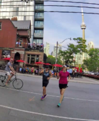 Runners heading west on Wellington Street, downtown Toronto